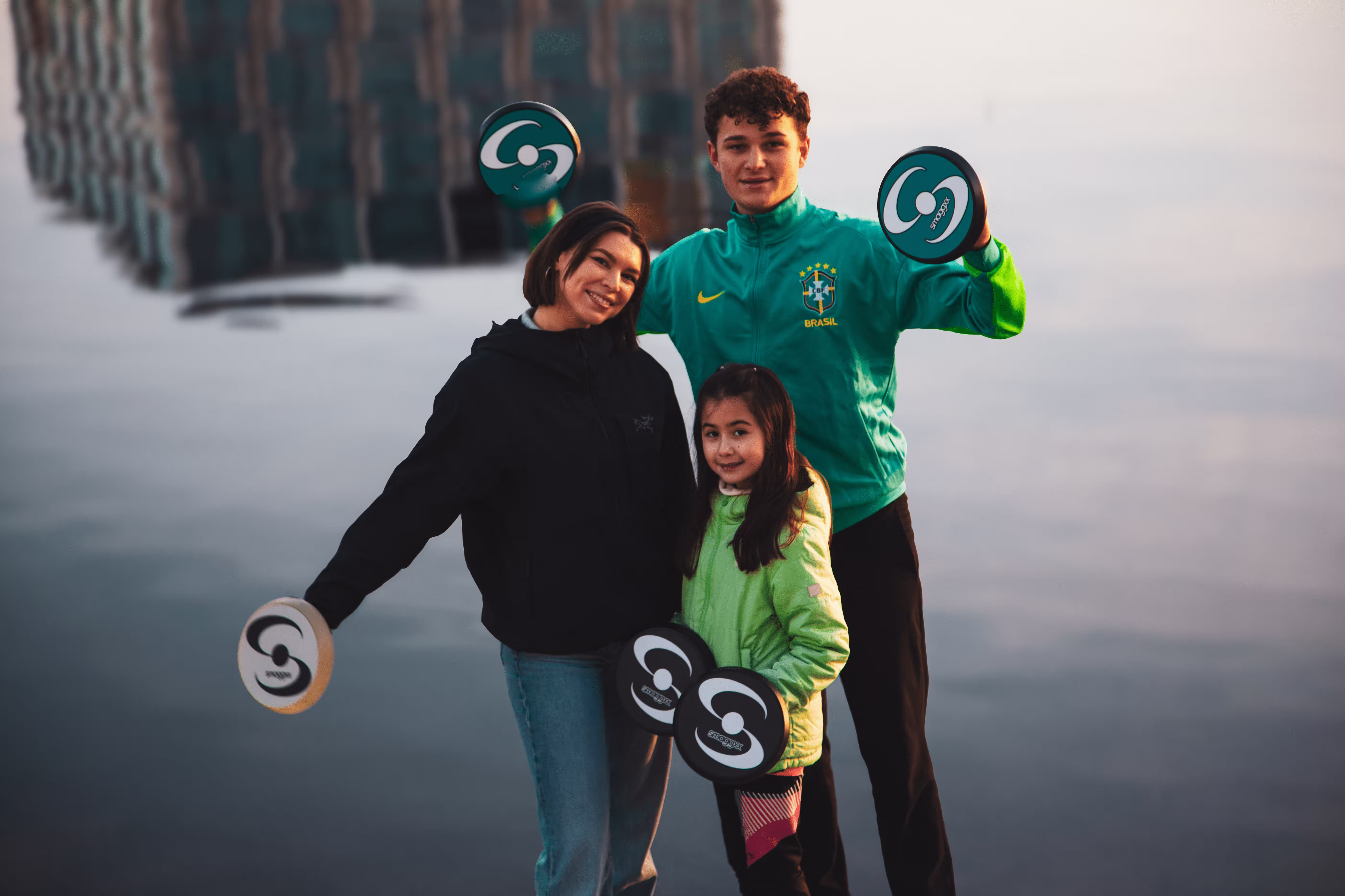 Smaggxx® players and family members holding Splates® outdoors